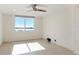 Sunlit bedroom featuring neutral tile flooring and a window with water views at 101 S Gulfstream Ave # 14G, Sarasota, FL 34236