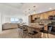Modern kitchen featuring a granite island, stainless appliances, and a seamless transition to the living area at 101 S Gulfstream Ave # 14G, Sarasota, FL 34236