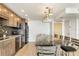 Kitchen with granite countertops, stainless steel appliances, and an island with seating at 101 S Gulfstream Ave # 14G, Sarasota, FL 34236
