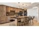 Updated kitchen featuring granite countertops, a mosaic backsplash, and a large island with barstool seating at 101 S Gulfstream Ave # 14G, Sarasota, FL 34236