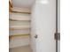 Bright pantry offers lots of storage space with light wood shelves at 101 S Gulfstream Ave # 14G, Sarasota, FL 34236