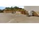 An outdoor patio offering a grill, table, and lush landscaping at 101 S Gulfstream Ave # 14G, Sarasota, FL 34236