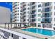 A stunning rooftop pool and recreation area with city views at 101 S Gulfstream Ave # 14G, Sarasota, FL 34236