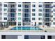 Beautiful outdoor pool area with ample seating and balcony views in this stunning condo building at 101 S Gulfstream Ave # 14G, Sarasota, FL 34236