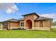 Charming single-story home with a covered entryway and well-manicured lawn at 1056 Tampa Rd, Venice, FL 34293