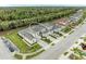 Aerial view showcasing the community, lush green landscaping, and modern townhome architecture at 11607 Meadowgate Pl, Bradenton, FL 34211