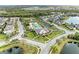 Beautiful aerial shot of a resort-style community, featuring a pool, clubhouse, and well-maintained landscaping at 11607 Meadowgate Pl, Bradenton, FL 34211
