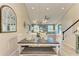 Bright dining room with modern lighting open to the living room at 11607 Meadowgate Pl, Bradenton, FL 34211