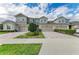 Townhomes featuring well maintained landscaping and paved driveways at 11607 Meadowgate Pl, Bradenton, FL 34211