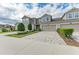 Charming two-story townhome featuring a private garage and a beautifully landscaped front yard at 11607 Meadowgate Pl, Bradenton, FL 34211