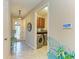 Hallway view of the laundry room and a decorative glass front door at 11607 Meadowgate Pl, Bradenton, FL 34211