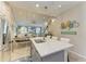 Open kitchen features a large island with quartz countertop and pendant lighting at 11607 Meadowgate Pl, Bradenton, FL 34211