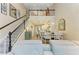 Open-concept living space with staircase, dining area, and kitchen beyond at 11607 Meadowgate Pl, Bradenton, FL 34211