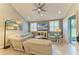 Comfortable living room with tile floors, plenty of natural light and ceiling fan at 11607 Meadowgate Pl, Bradenton, FL 34211