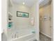 The bright bathroom features a large soaking tub and built-in shelves at 11607 Meadowgate Pl, Bradenton, FL 34211