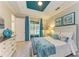 A bright main bedroom has a blue ceiling, white trim, and a screened-in porch at 11607 Meadowgate Pl, Bradenton, FL 34211