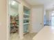 Walk-in pantry with ample shelving and storage space for kitchen essentials at 11607 Meadowgate Pl, Bradenton, FL 34211