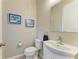 Powder room featuring a white vanity with sink and toilet at 11607 Meadowgate Pl, Bradenton, FL 34211