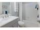 Bright bathroom features a shower-tub combo and stacked white towels creating a clean, spa-like atmosphere at 12014 Forest Park Cir, Bradenton, FL 34211