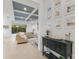 Open-concept living room with tiled floors, decorative furniture and pool view at 12014 Forest Park Cir, Bradenton, FL 34211
