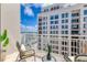 Relax on this condo's balcony featuring comfortable seating and spectacular views of the city at 1350 Main St # 1701, Sarasota, FL 34236