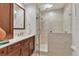 Bathroom showcasing a glass enclosed shower with tiled walls, a rain shower head, and a built-in shelf at 1350 Main St # 1701, Sarasota, FL 34236