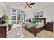 Cozy bedroom with balcony access, modern furniture, and ample natural light at 1350 Main St # 1701, Sarasota, FL 34236