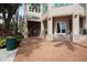 Commercial building entrance featuring a TD Ameritrade branch, well-maintained landscaping, and brick pathway at 1350 Main St # 1701, Sarasota, FL 34236