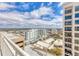 Stunning city views from a high-rise balcony showcasing the vibrant cityscape and beautiful blue sky at 1350 Main St # 1701, Sarasota, FL 34236