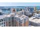 Elevated angle shows luxury condos with water views and other residential buildings in a well-populated city at 1350 Main St # 1701, Sarasota, FL 34236