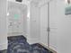 Hallway featuring patterned carpet and neutral walls leading to the unit at 1350 Main St # 1701, Sarasota, FL 34236
