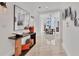 Bright hallway with marble floors, modern decor, and views into the dining area at 1350 Main St # 1701, Sarasota, FL 34236