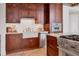 Modern kitchen with stainless steel appliances, granite countertops, and custom wood cabinets at 1350 Main St # 1701, Sarasota, FL 34236