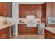 Gorgeous kitchen with custom wood cabinets, stainless appliances, and stone countertops at 1350 Main St # 1701, Sarasota, FL 34236