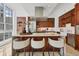 Modern kitchen with stainless steel appliances, island with seating, and marble countertops at 1350 Main St # 1701, Sarasota, FL 34236