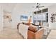 Bright living room with a brown leather sofa, city views, and modern decor at 1350 Main St # 1701, Sarasota, FL 34236
