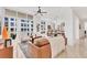Open living area with large windows, a balcony, and stylish contemporary furniture at 1350 Main St # 1701, Sarasota, FL 34236