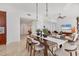 Open concept living and dining room with lots of natural light and a wooden dining room table at 1350 Main St # 1701, Sarasota, FL 34236
