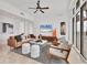 Inviting living room featuring a TV, modern decor, and access to the balcony at 1350 Main St # 1701, Sarasota, FL 34236