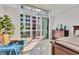 Bright main bedroom with balcony access, stylish furniture, and elegant finishes at 1350 Main St # 1701, Sarasota, FL 34236