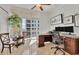 Bright office features a large window, a ceiling fan, and a large desk with dual monitors at 1350 Main St # 1701, Sarasota, FL 34236