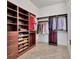 Organized walk-in closet with custom shelving, shoe racks, and ample storage space at 1350 Main St # 1701, Sarasota, FL 34236