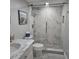 Stylish bathroom featuring marble countertop, modern fixtures, and a glass-enclosed shower at 1350 N Portofino Dr # 108, Sarasota, FL 34242