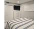 Bedroom with TV and full closet at 1350 N Portofino Dr # 108, Sarasota, FL 34242