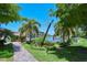 Scenic community grounds with lush landscaping and a canal view at 1350 N Portofino Dr # 108, Sarasota, FL 34242