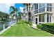 Beautiful waterfront condo with green lawn, landscaping, a dock and canal views at 1350 N Portofino Dr # 108, Sarasota, FL 34242
