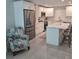 Bright kitchen with white cabinets, stainless steel appliances, and a center island with bar seating at 1350 N Portofino Dr # 108, Sarasota, FL 34242