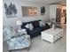Relaxing living room features cozy seating and stylish decor with a view of the modern kitchen at 1350 N Portofino Dr # 108, Sarasota, FL 34242
