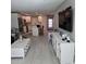 Inviting living room featuring an open floor plan connecting to the modern, renovated kitchen at 1350 N Portofino Dr # 108, Sarasota, FL 34242