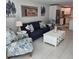 Cozy living room features tasteful decor with a coastal design, modern furniture, and plenty of natural light at 1350 N Portofino Dr # 108, Sarasota, FL 34242